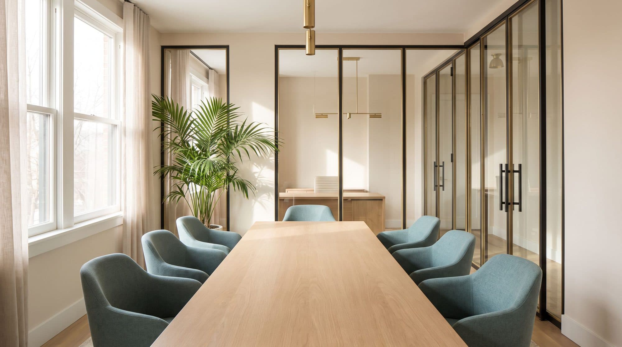 A bright conference room set up for a closing